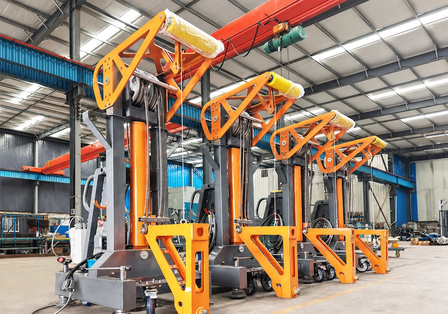 Four mobile lifting units arranged in a workshop